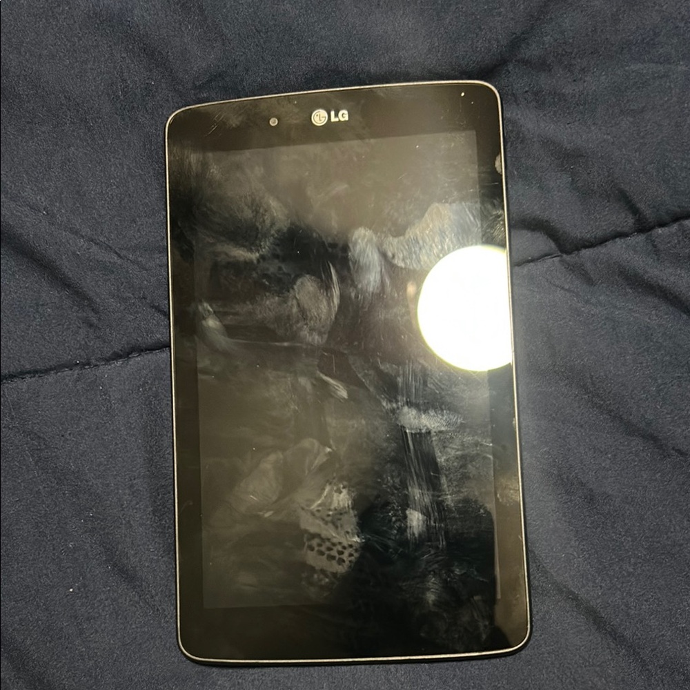 LG Black Tablet with Reflective Screen and Rounded Corners